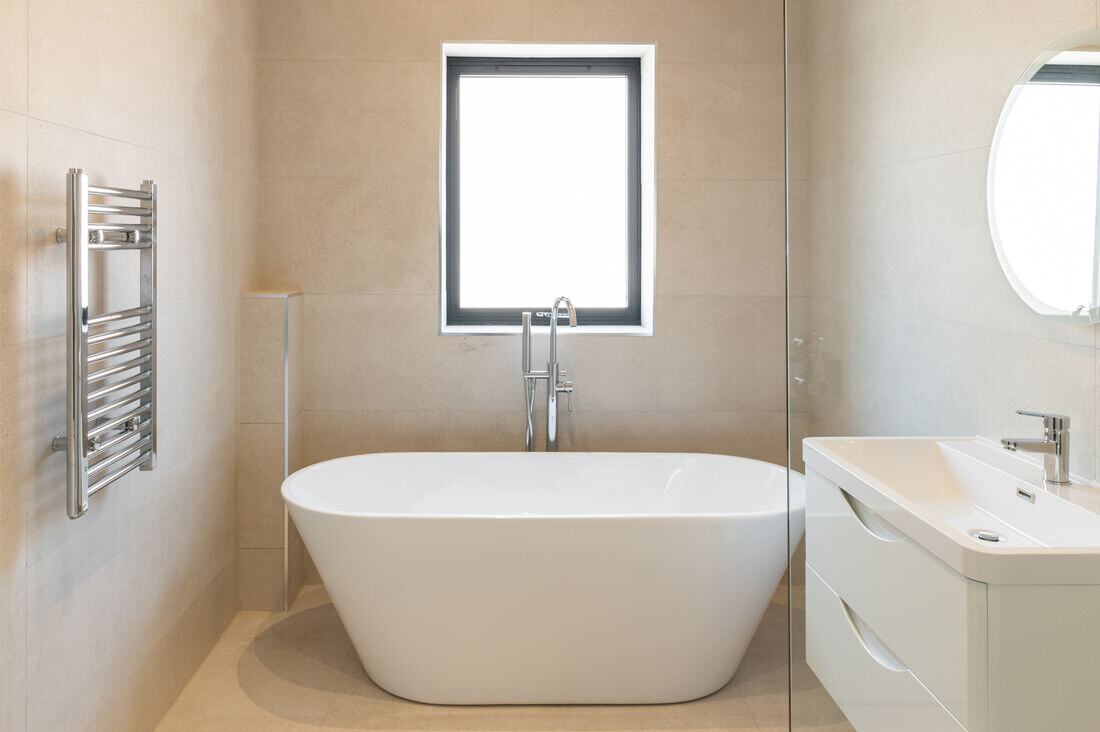 Bathroom with a freestanding bath and walk-in shower.